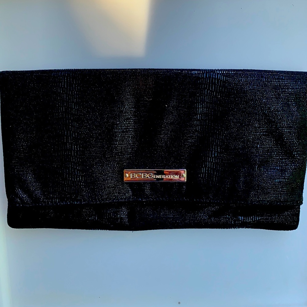 Like new BCBGeneration folded clutch.
